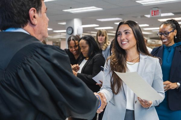 law student shaking hands with judge