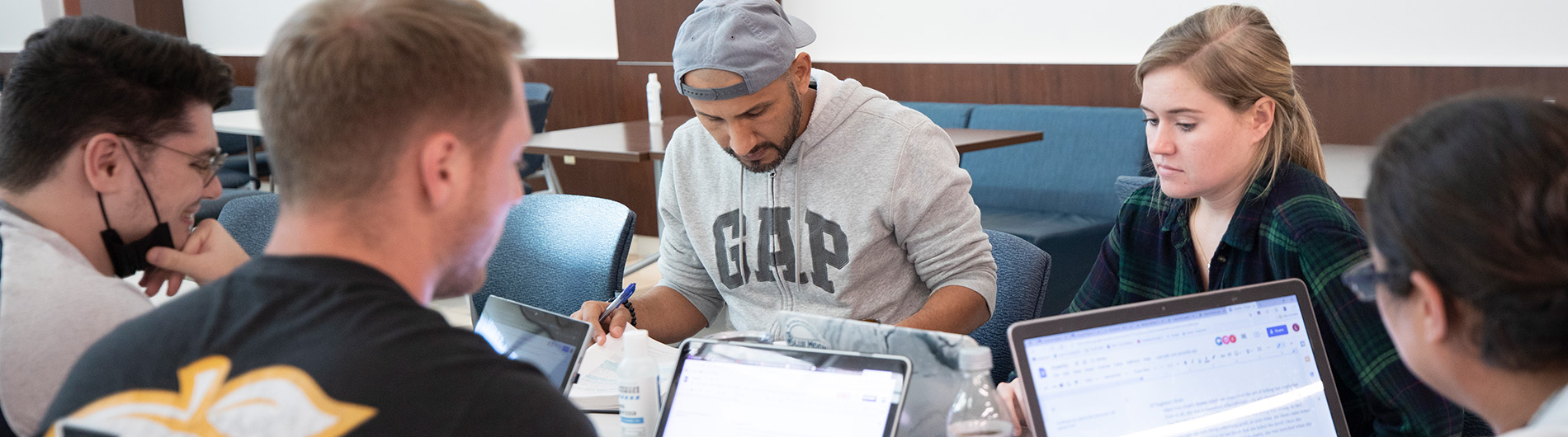 Students studying together around table