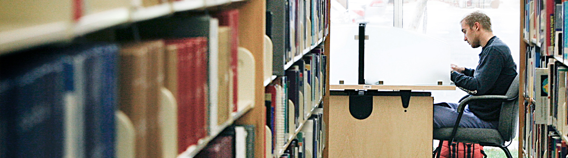 NSU student studying in law library
