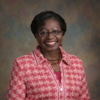 Portrait of a smiling woman on a brown background