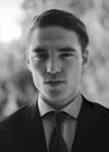 Black and white portrait of a man in a suit on a blurred background