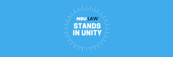 NSU Stands In Unity banner with white lettering on a blue background